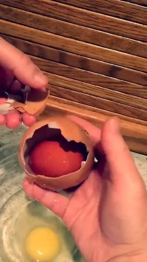 Farmer Loses His Mind After Looking Inside A Colossal Chicken Egg